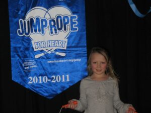 Cherokee Connell, with the Jump Rope for Heart Banner.