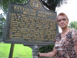 Former East Atlanta resident Ina Evans at the Historic Marker where the battle began. Her great grandfather was there when it started. Photo by Henry Bryant
