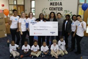 Parkside staff and students receiving a $10,000 check from OshKosh/Carters. Photo by RM Lathan