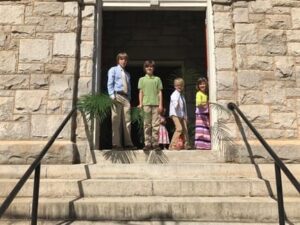 On Palm Sunday 2017, Young St. Paulers welcomed churchgoers at the door with palm branches after the Egg Hunt in the park and Palm Procession to the church. Photo by Rebecca Wallace