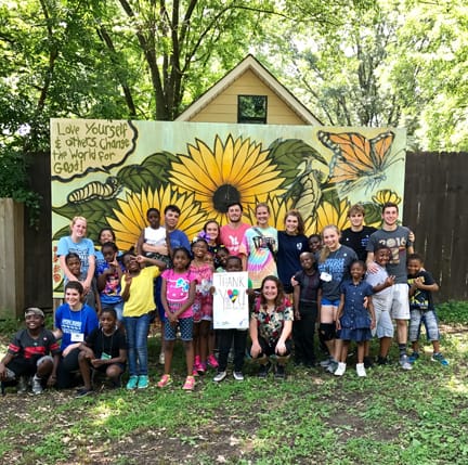 Youth Works volunteers pose with campers for an end of summer farewell. Photo by Jill Sieder.