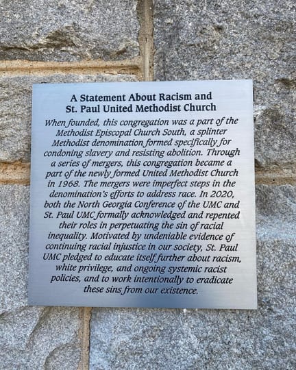 The plaque on the exterior of St. Paul UMC.